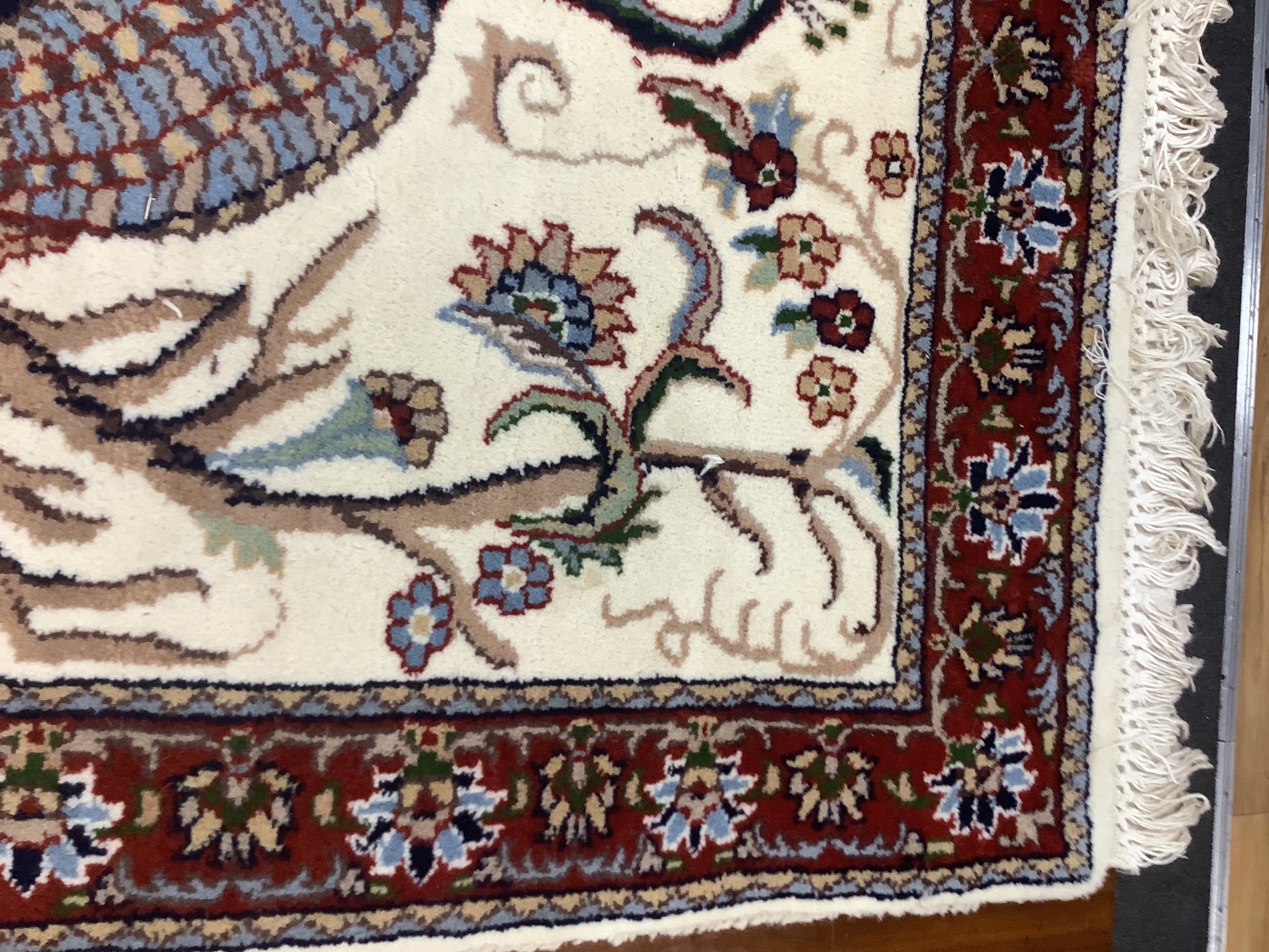 A Tabriz ivory ground 'Peacock' rug, 122 x 120cm
